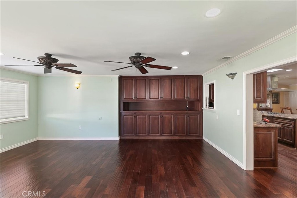 18590 Roberts Road Riverside, CA 92508 - Photo 23 of 66 a kitchen with a refrigerator and a wooden floor