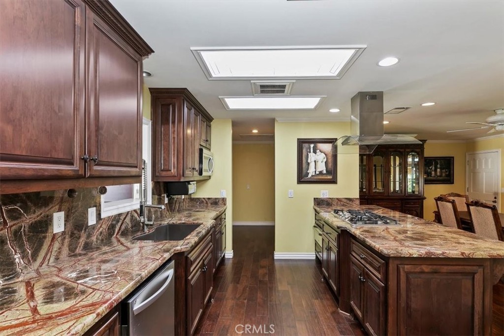 18590 Roberts Road Riverside, CA 92508 - Photo 29 of 66 a kitchen with granite countertop stainless steel appliances and wooden cabinets
