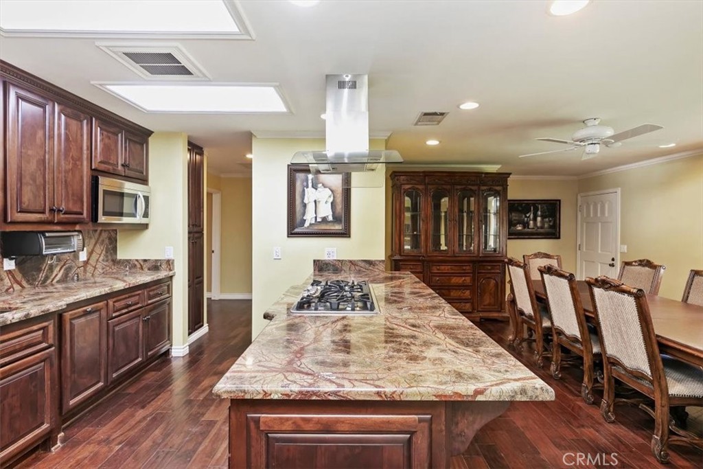 18590 Roberts Road Riverside, CA 92508 - Photo 30 of 66 a kitchen with stainless steel appliances granite countertop a stove refrigerator and cabinets