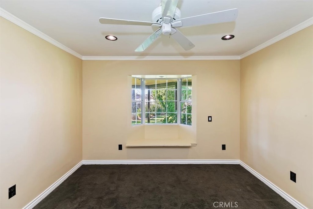 18590 Roberts Road Riverside, CA 92508 - Photo 35 of 66 an empty room with a window and a ceiling fan