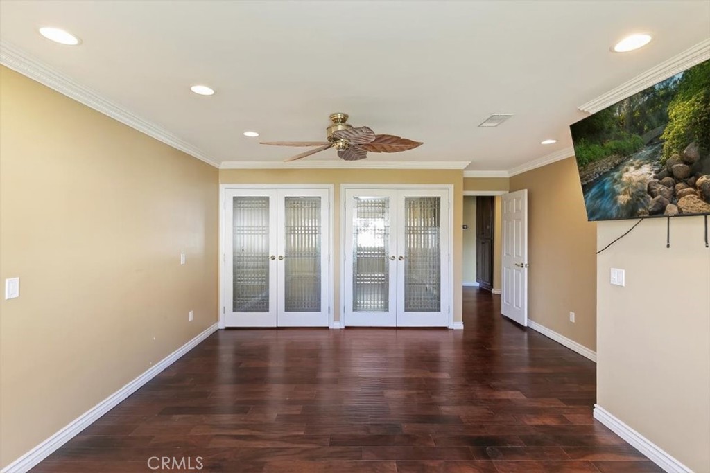 18590 Roberts Road Riverside, CA 92508 - Photo 39 of 66 a view of an empty room with wooden floor and a window