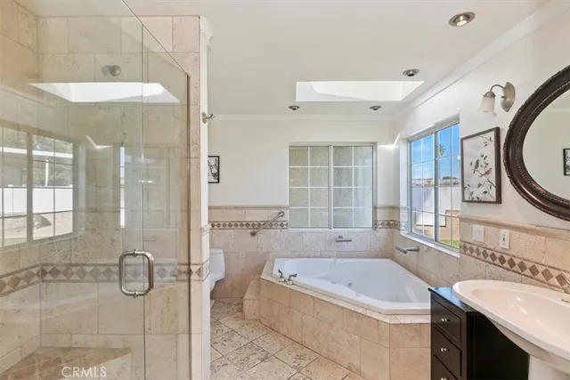 a view of a garden with a table and chairs under an umbrella