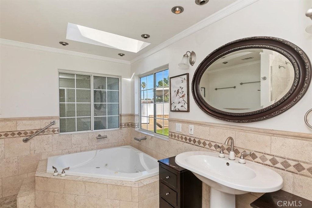 18590 Roberts Road Riverside, CA 92508 - Photo 41 of 66 a bathroom with a sink and a mirror