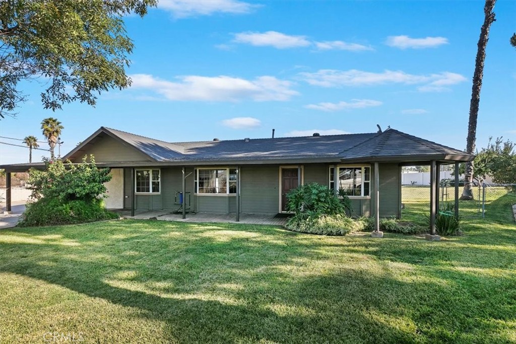18590 Roberts Road Riverside, CA 92508 - Photo 5 of 66 a front view of a house with a yard and potted plants
