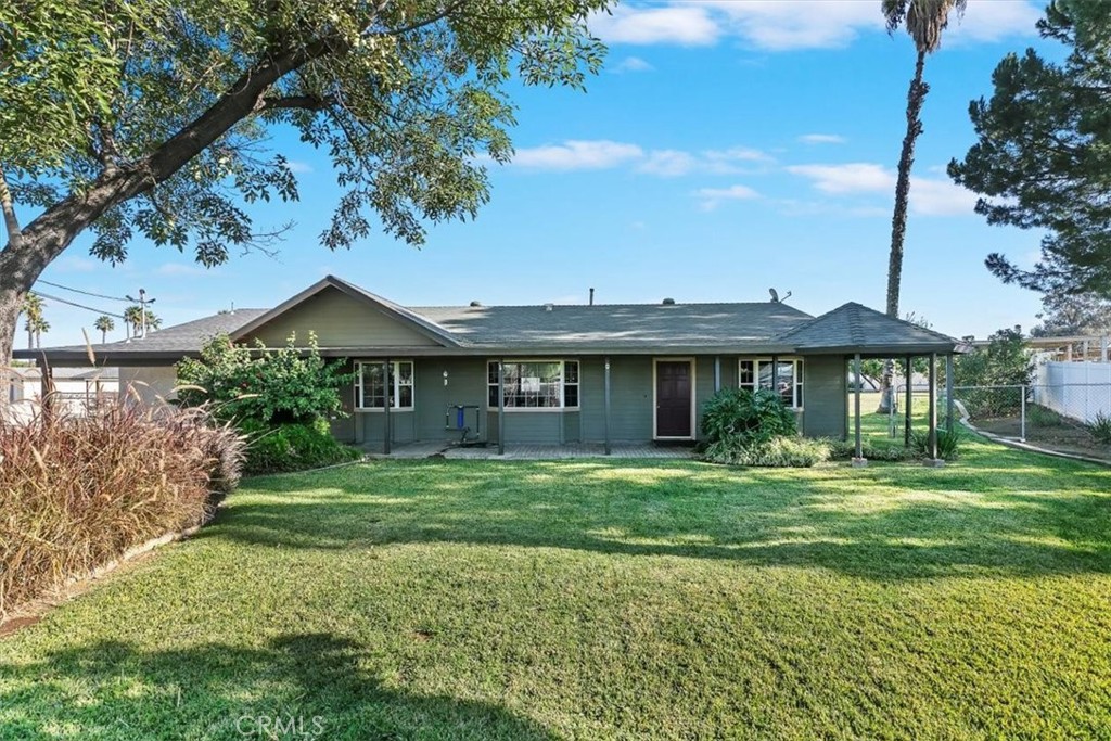 18590 Roberts Road Riverside, CA 92508 - Photo 7 of 66 a front view of a house with a garden