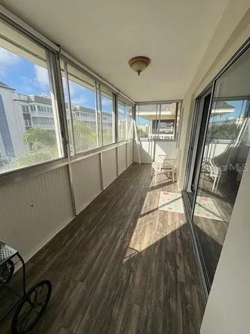 a bedroom with a bed next to a window