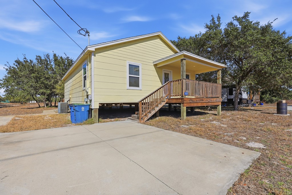 2121 Lone Star Road Rockport, TX 78382 - Photo 1 of 29 a view of a house with a yard