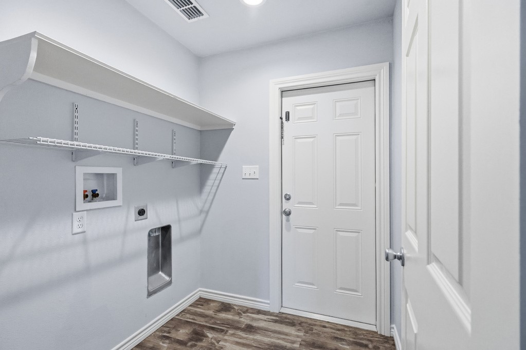 2121 Lone Star Road Rockport, TX 78382 - Photo 23 of 29 a view of a hallway with closet and cabinet
