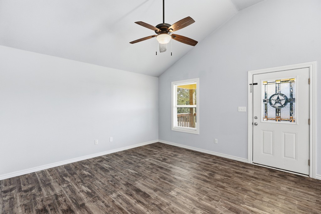 2121 Lone Star Road Rockport, TX 78382 - Photo 8 of 29 wooden floor in an empty room with a window