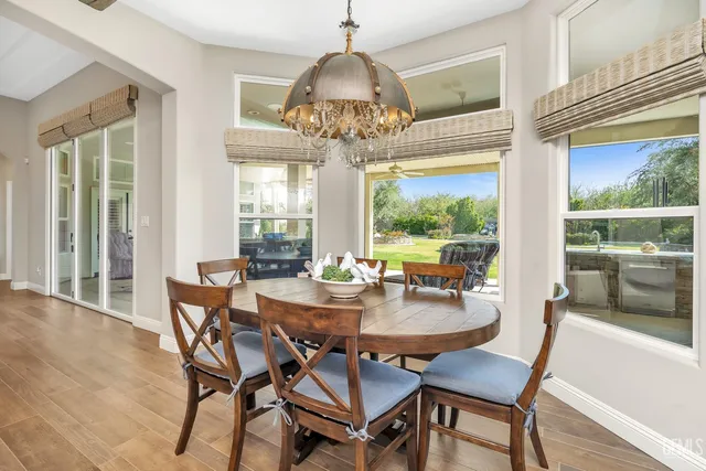 a view of a backyard with plants and a patio