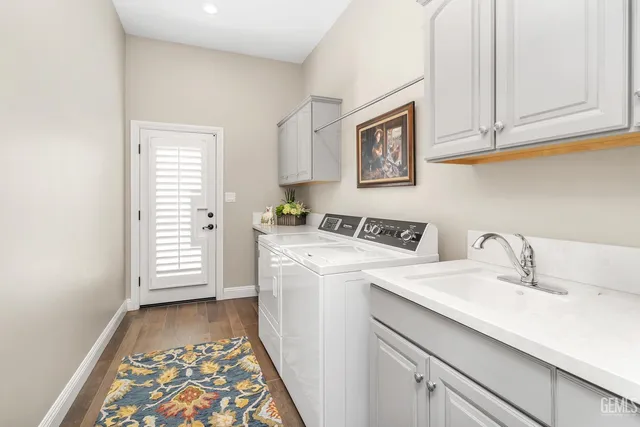 a living room with furniture a potted plant and a large window