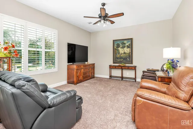 an aerial view of a house with a yard and potted plants