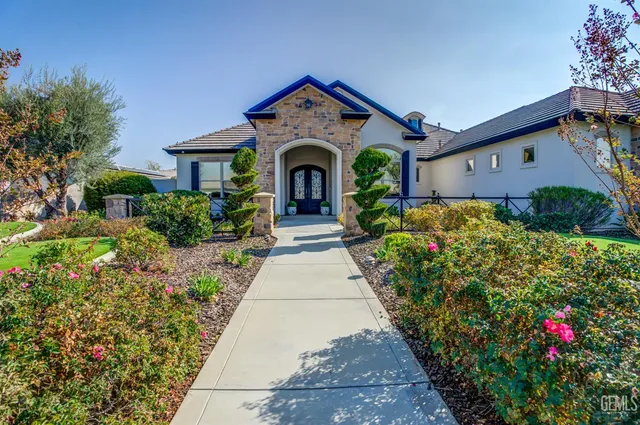 a living room with furniture fireplace and a flat screen tv
