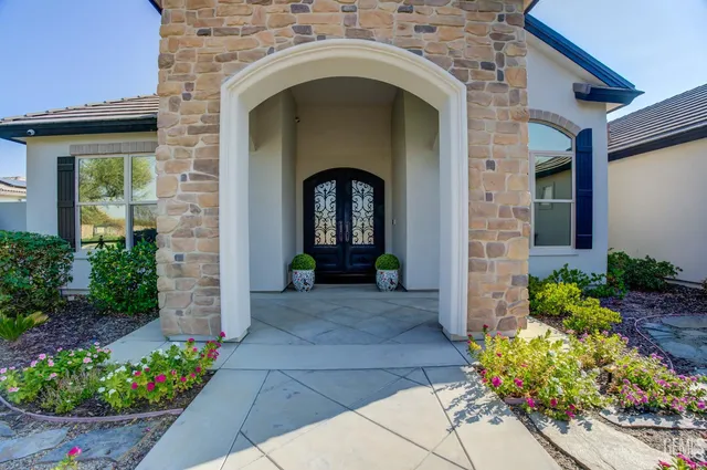 a view of a dining room with furniture wooden floor and chandelier