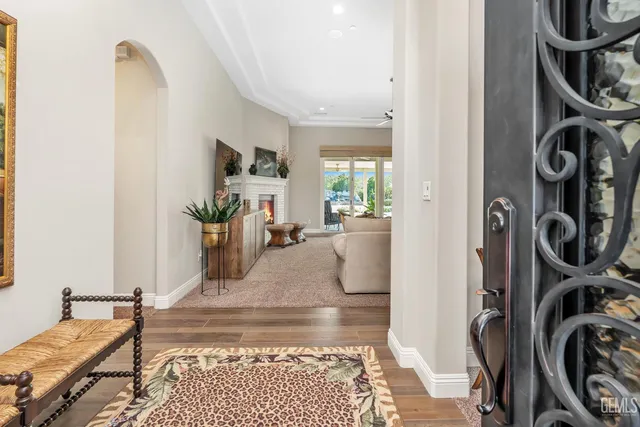 a kitchen with granite countertop a sink stainless steel appliances and cabinets