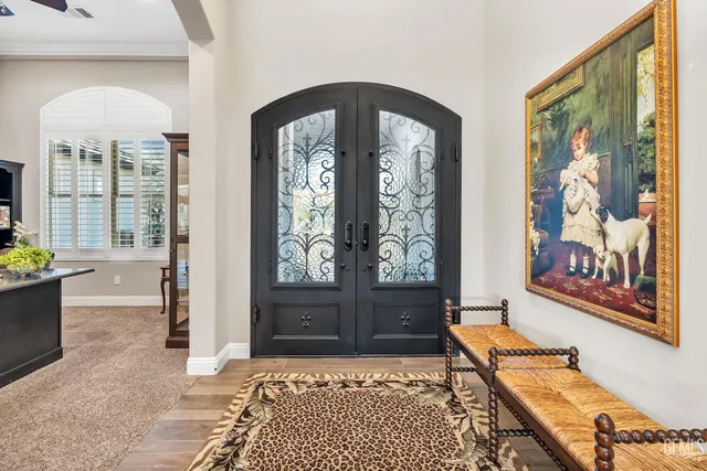 a kitchen with cabinets appliances and a wooden floor