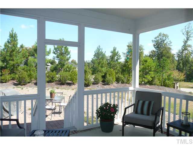 2755 Hidden Waters Circle Raleigh, NC 27614 - Photo 16 of 19 Covered Porch off the breakfast nook looks over one of the more private backyards in Bedford. Landscaped berm allow for privacy and this home does not back directly to another home.