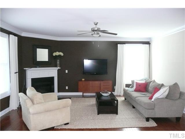 2755 Hidden Waters Circle Raleigh, NC 27614 - Photo 5 of 19 Family Room offers a great space for relaxing and entertaining as it is open to the kitchen and entrance to the covered porch. Corner fireplace is flanked by windows. Two walls accented with decorative paint enriches the feel of the room.