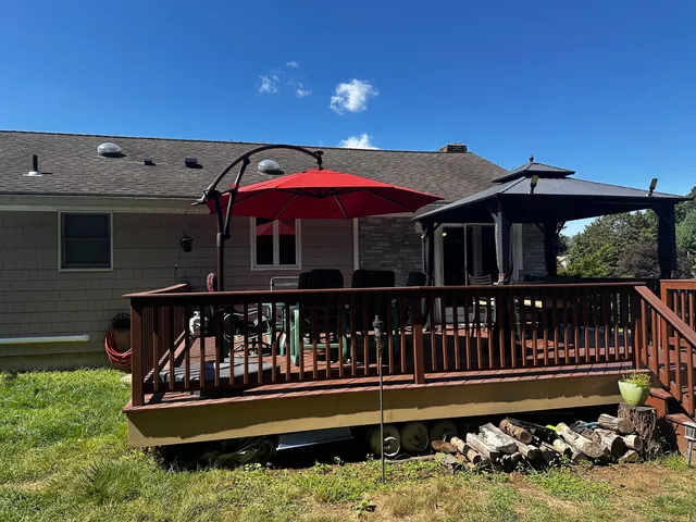 a view of a roof deck with wooden fence