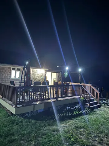 a view of an interior swimming pool having patio