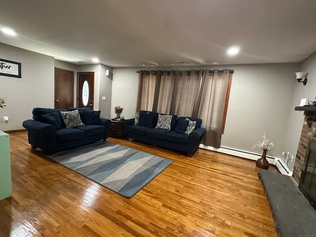 a living room with furniture rug and window