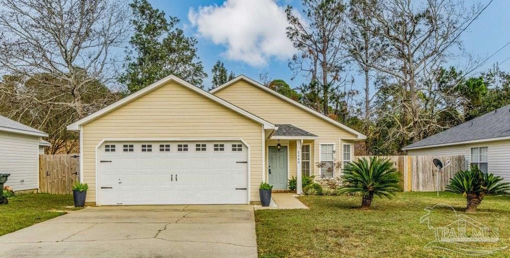 2466 Redoubt Avenue Pensacola, FL 32507 - Photo 1 of 27 a view of a house with a yard and potted plants