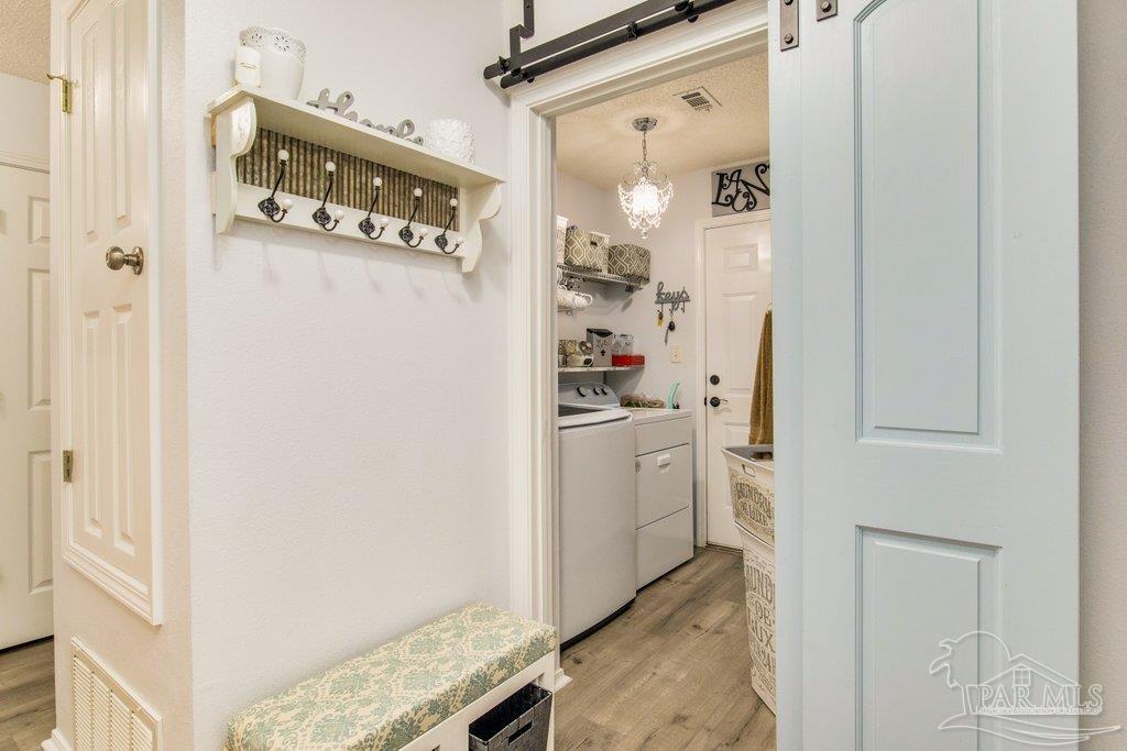 2466 Redoubt Avenue Pensacola, FL 32507 - Photo 13 of 27 a room with white cabinets and white appliances