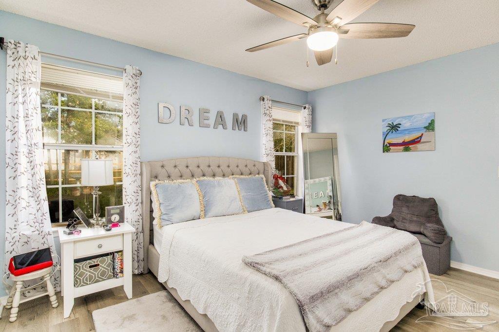 2466 Redoubt Avenue Pensacola, FL 32507 - Photo 15 of 27 a bedroom with a bed and a window
