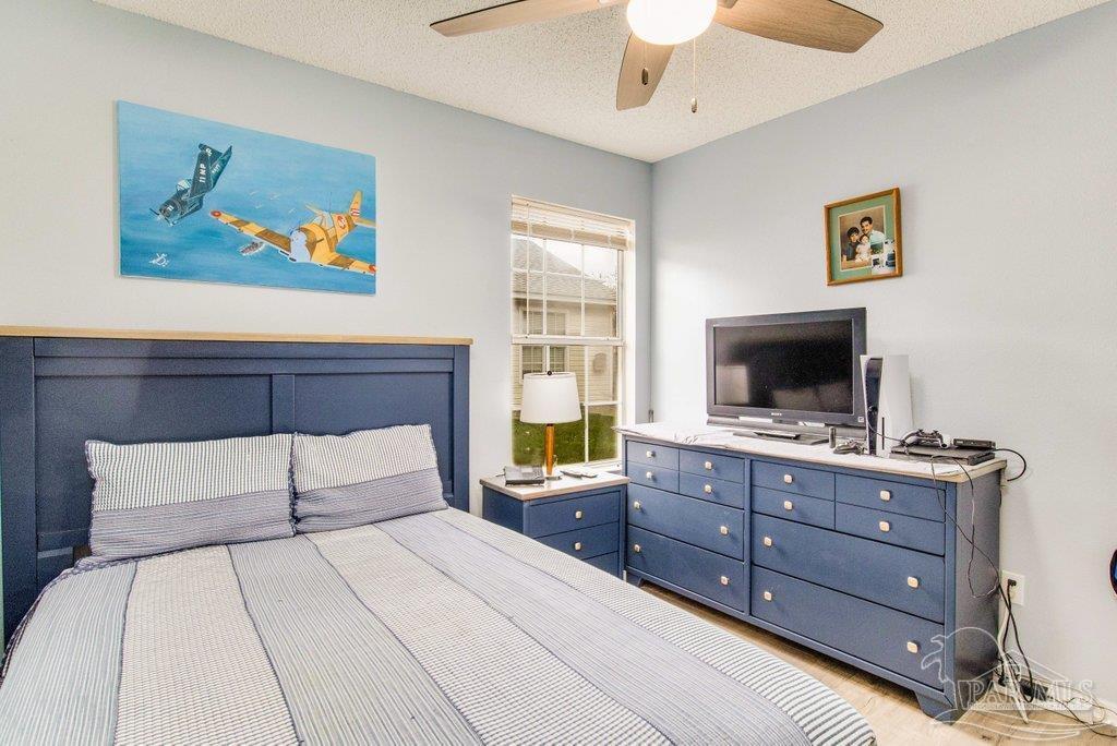 2466 Redoubt Avenue Pensacola, FL 32507 - Photo 20 of 27 a bedroom with a bed and a television