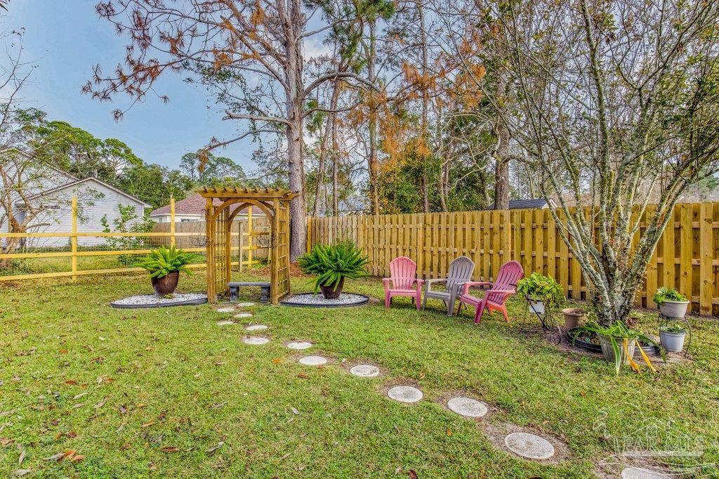 2466 Redoubt Avenue Pensacola, FL 32507 - Photo 24 of 27 a view of yard with swimming pool and green space
