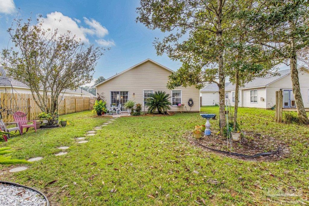 2466 Redoubt Avenue Pensacola, FL 32507 - Photo 26 of 27 a front view of a house with garden