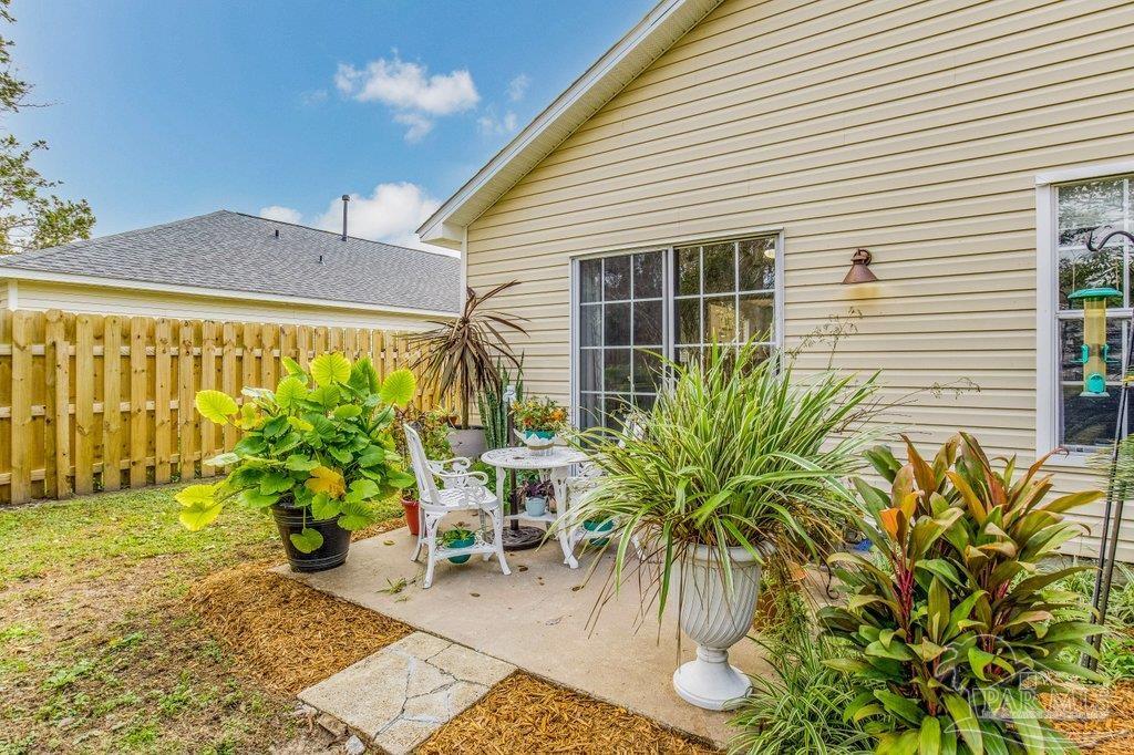 2466 Redoubt Avenue Pensacola, FL 32507 - Photo 27 of 27 a potted plant sitting in front of a house