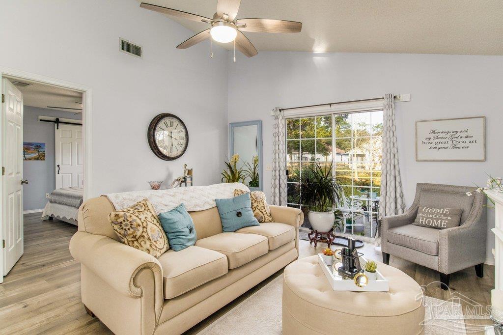 2466 Redoubt Avenue Pensacola, FL 32507 - Photo 3 of 27 a living room with furniture and a large window