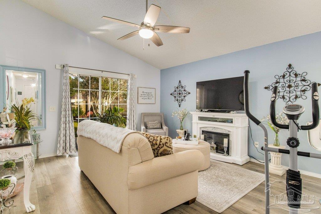2466 Redoubt Avenue Pensacola, FL 32507 - Photo 4 of 27 a living room with furniture and a flat screen tv