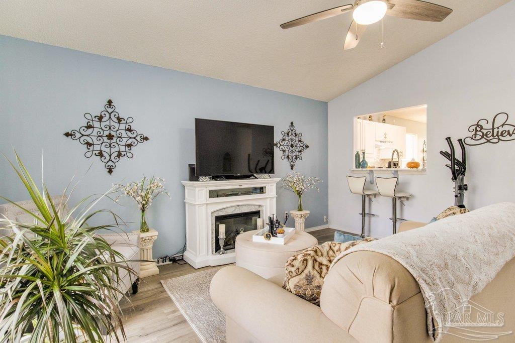 2466 Redoubt Avenue Pensacola, FL 32507 - Photo 5 of 27 a living room with furniture fireplace and flat screen tv