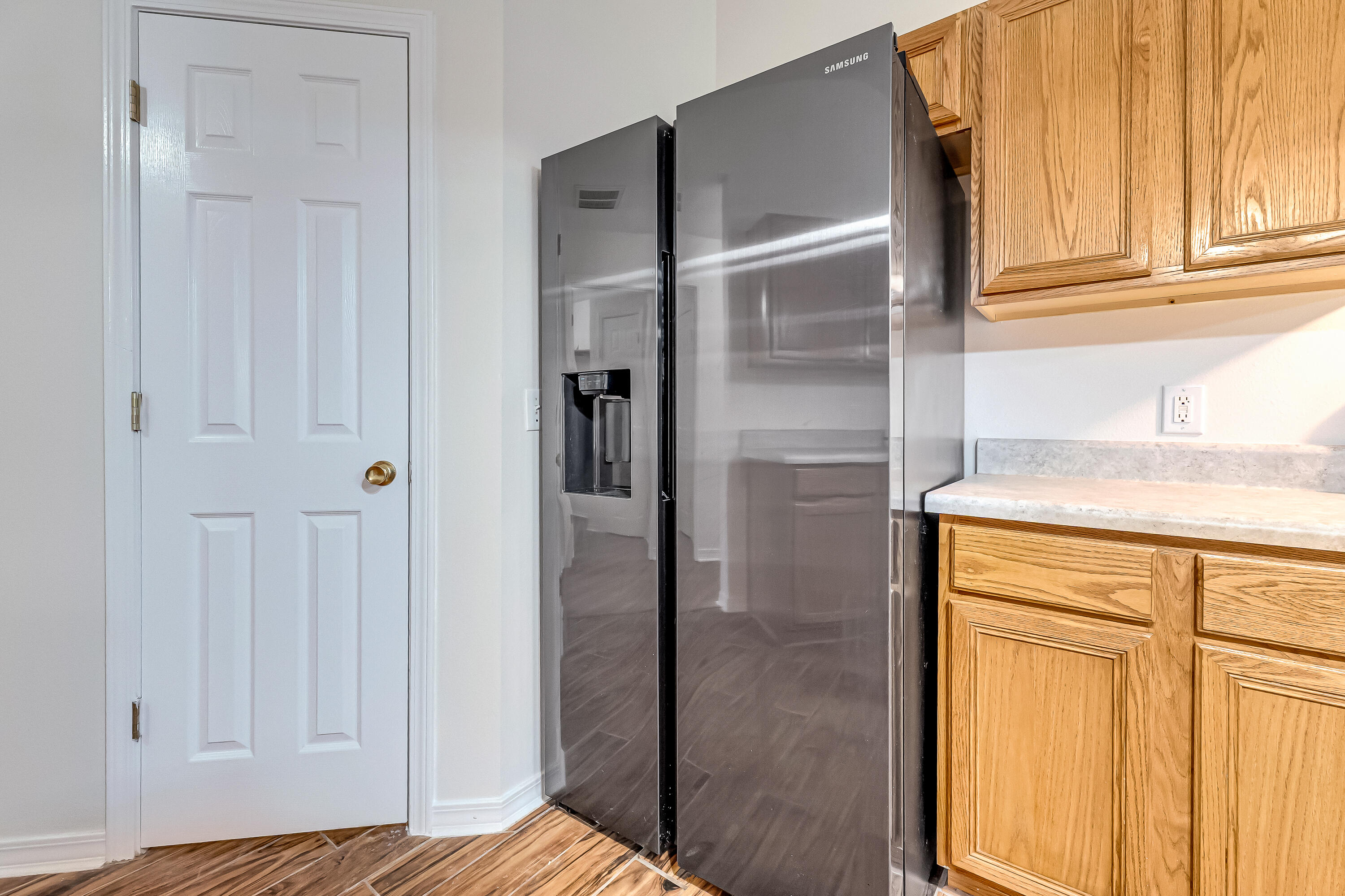 427 Hatchee Drive Crestview, FL 32536 - Photo 21 of 77 KITCHEN PANTRY AND SIBE BY SIDE FRIDGE