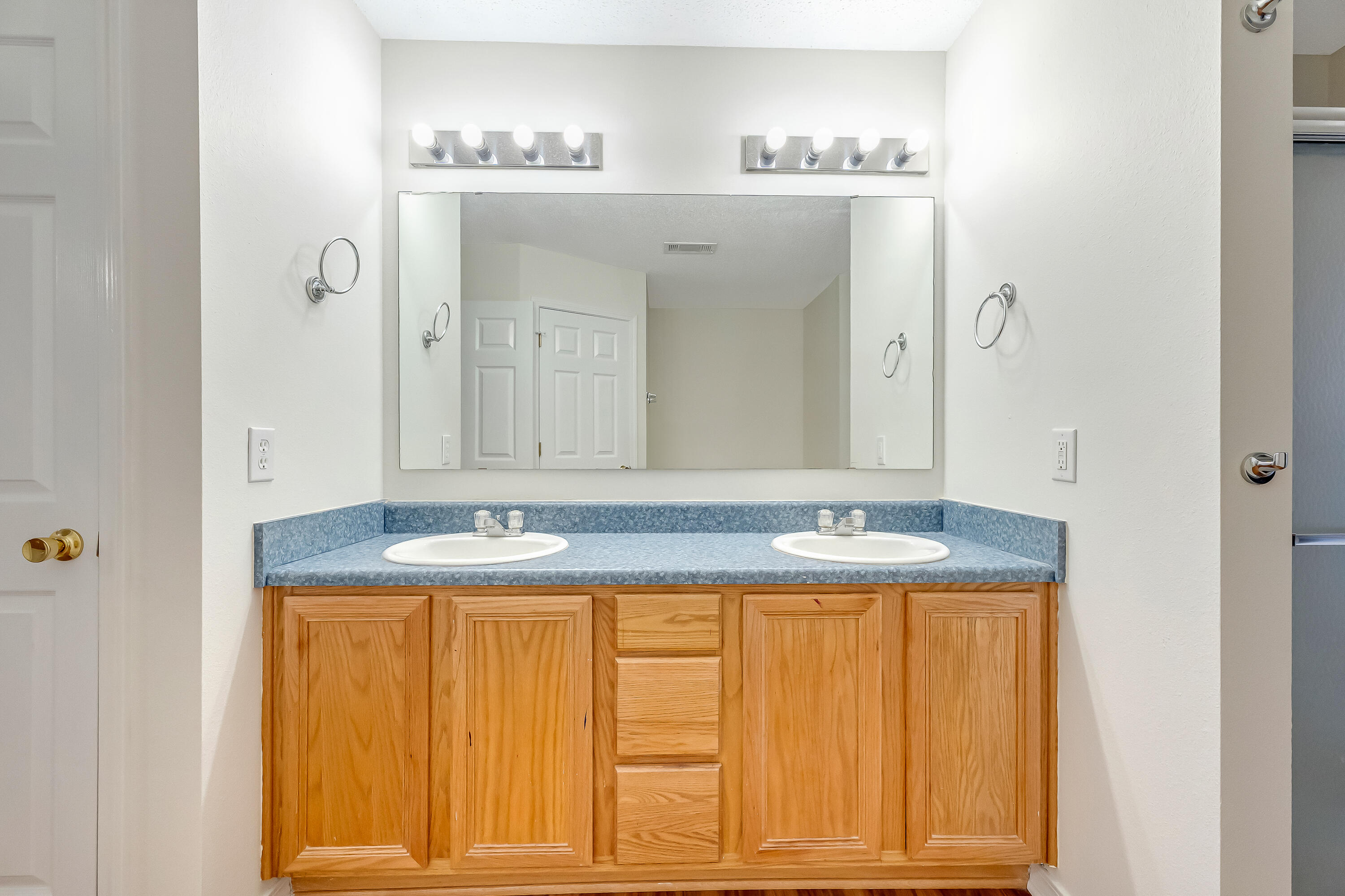 427 Hatchee Drive Crestview, FL 32536 - Photo 34 of 77 a bathroom with a granite countertop sink and a mirror