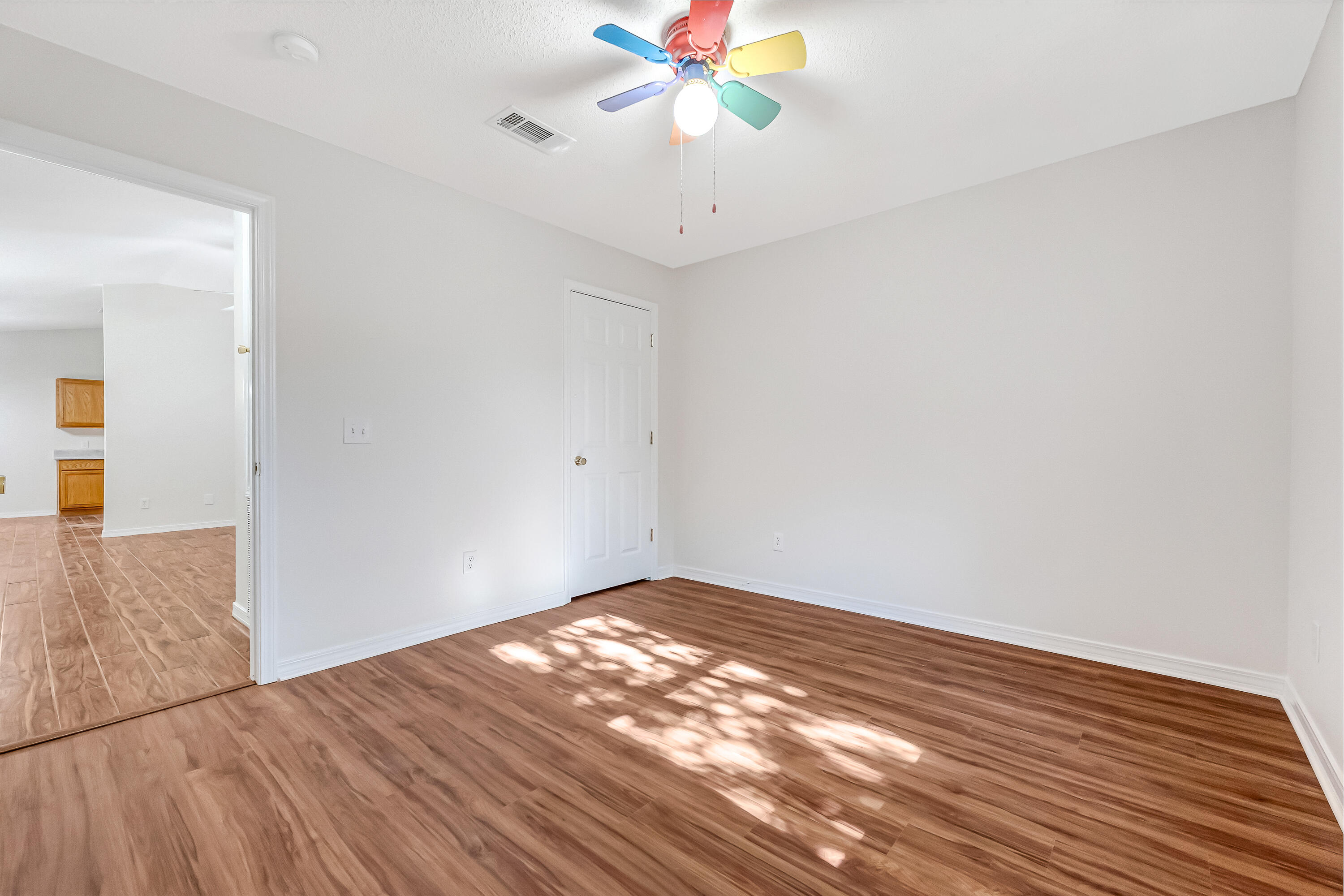 427 Hatchee Drive Crestview, FL 32536 - Photo 43 of 77 wooden floor in an empty room with a window