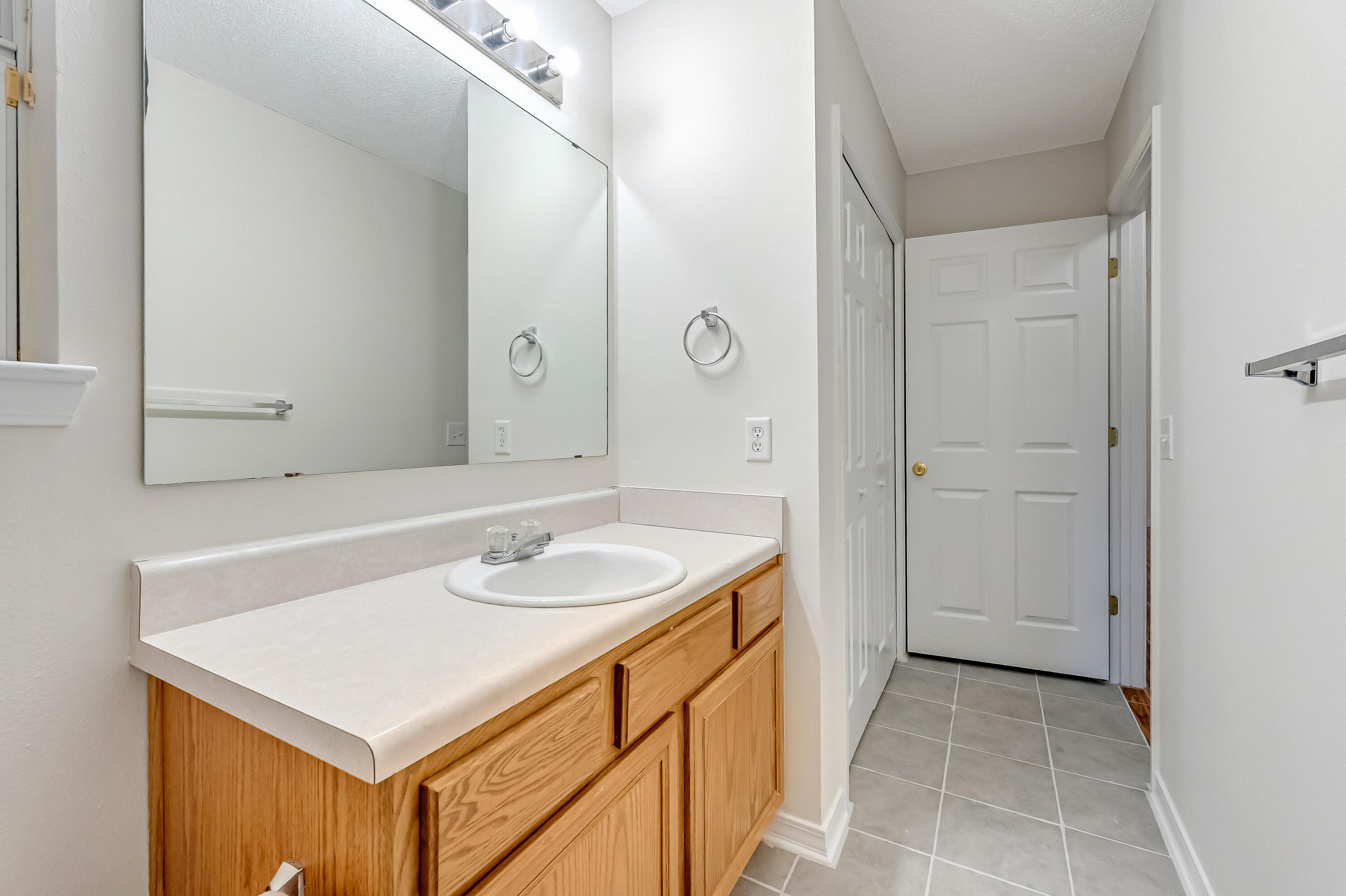 427 Hatchee Drive Crestview, FL 32536 - Photo 45 of 77 a bathroom with a sink a vanity and a mirror