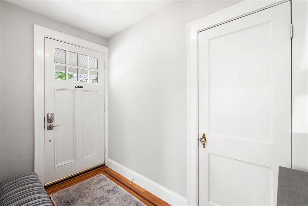 9 Dunton Road, Unit 9 Watertown, MA 02472 - Photo 4 of 39 a view of room with window and hardwood floor