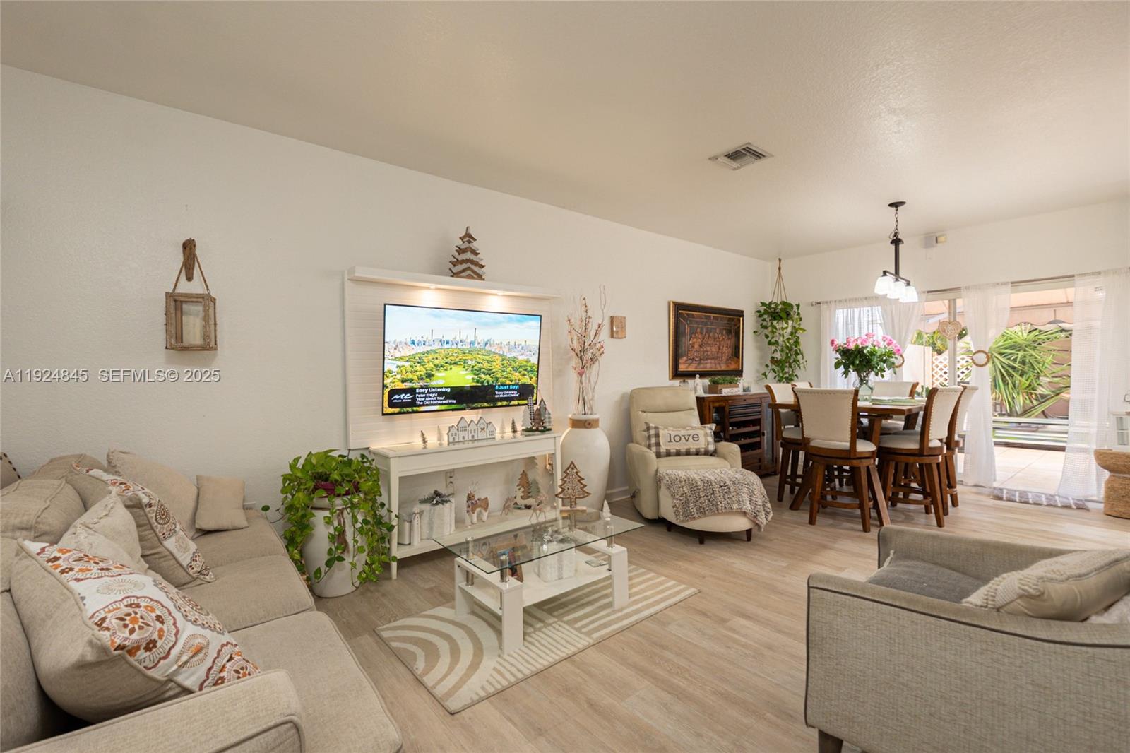 14738 Southwest 9th Lane Miami, FL 33194 - Photo 14 of 31 a living room with furniture and a flat screen tv