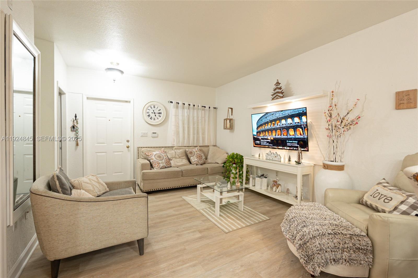 14738 Southwest 9th Lane Miami, FL 33194 - Photo 16 of 31 a living room with furniture and a flat screen tv