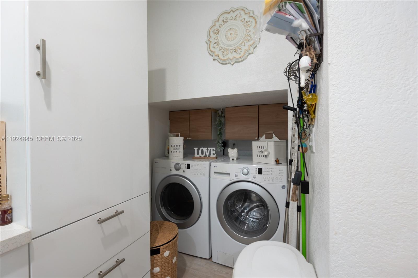 14738 Southwest 9th Lane Miami, FL 33194 - Photo 20 of 31 a view of a hallway with washer and dryer