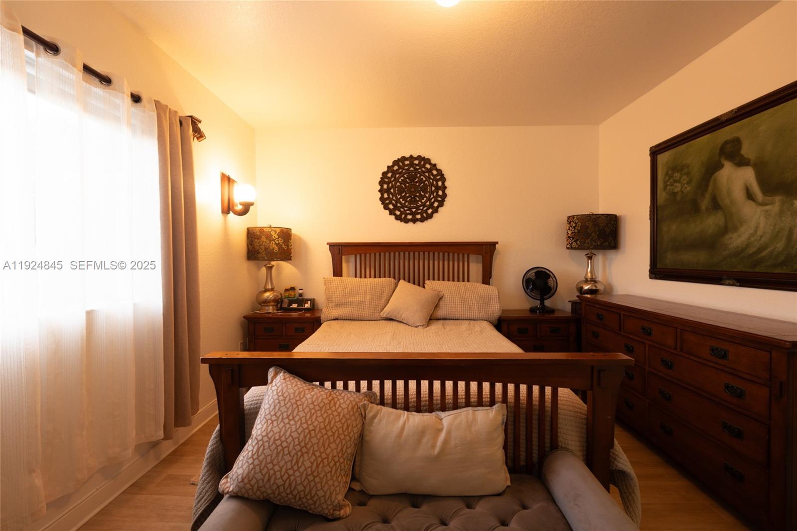 14738 Southwest 9th Lane Miami, FL 33194 - Photo 25 of 31 a bedroom with a bed and a flat tv screen on the dresser