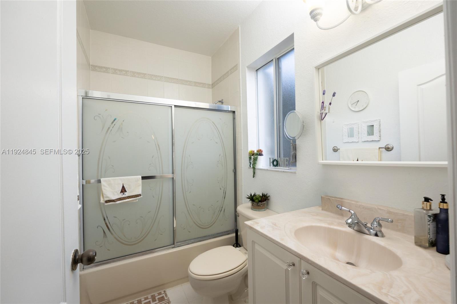 14738 Southwest 9th Lane Miami, FL 33194 - Photo 26 of 31 a bathroom with a sink a toilet and shower