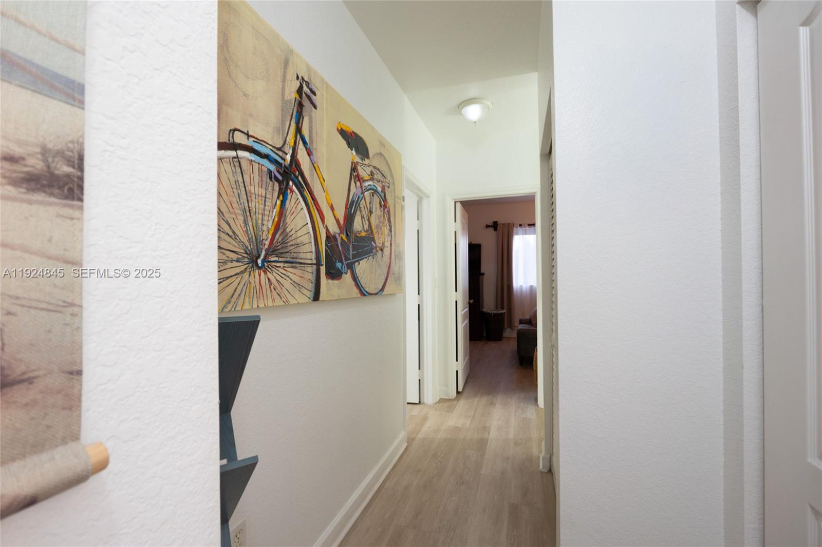 14738 Southwest 9th Lane Miami, FL 33194 - Photo 29 of 31 a view of a hallway with wooden floor and entryway