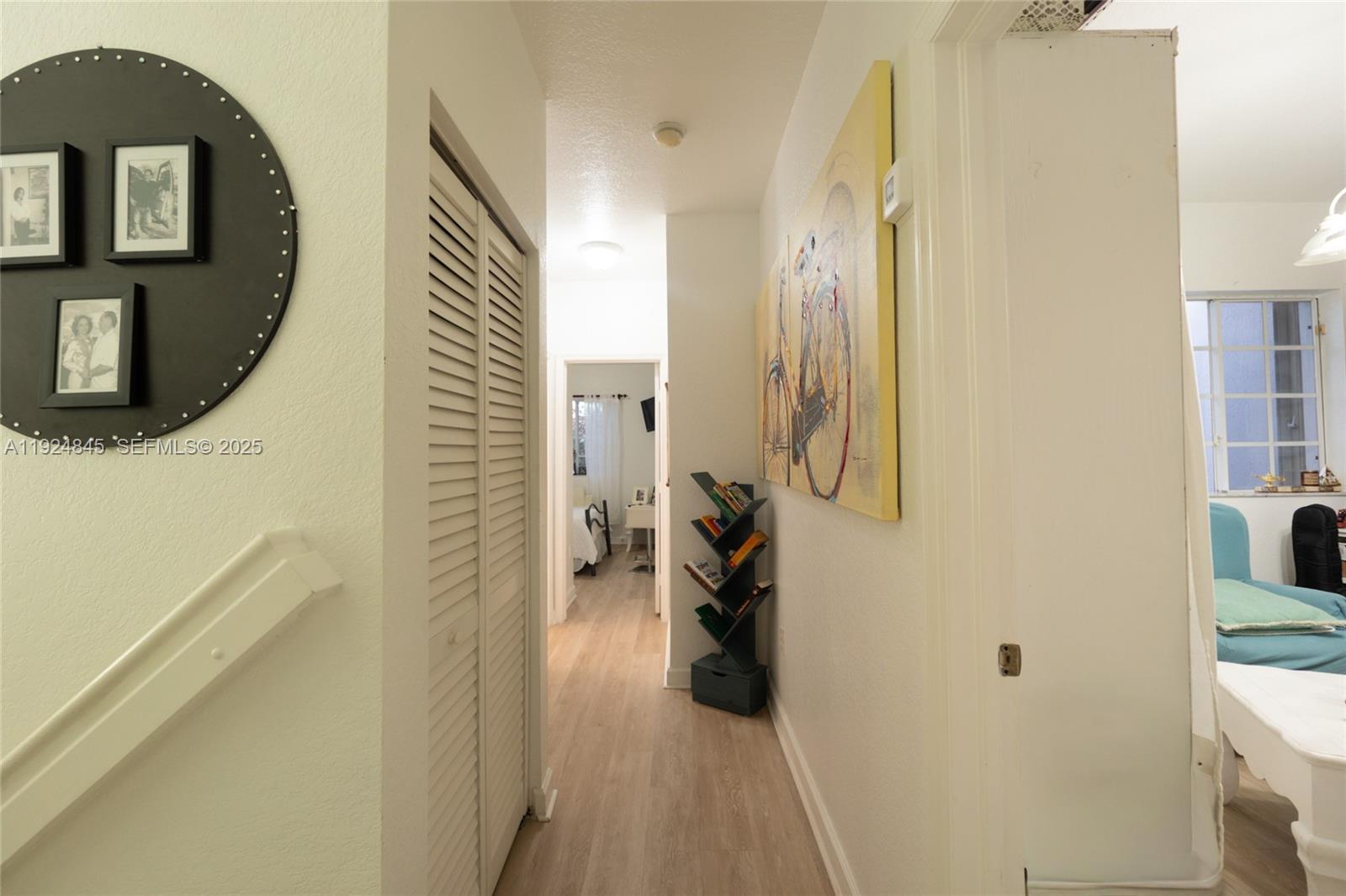 14738 Southwest 9th Lane Miami, FL 33194 - Photo 30 of 31 a view of a hallway with a livingroom and a bathroom
