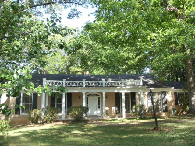 1808 Lincoln Road, Unit 32 Macon, GA 31211 - Photo 1 of 1 a front view of multi story residential apartment building with yard and outdoor seating