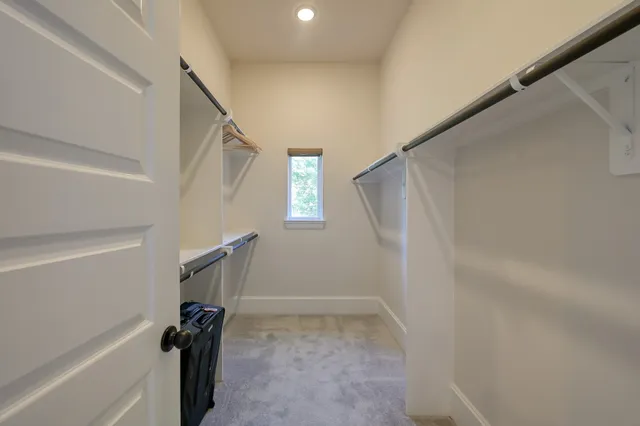 a spacious bathroom with a tub sink a toilet and a shower