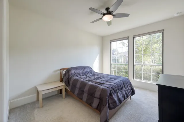a view of a hallway with a chandelier and entryway